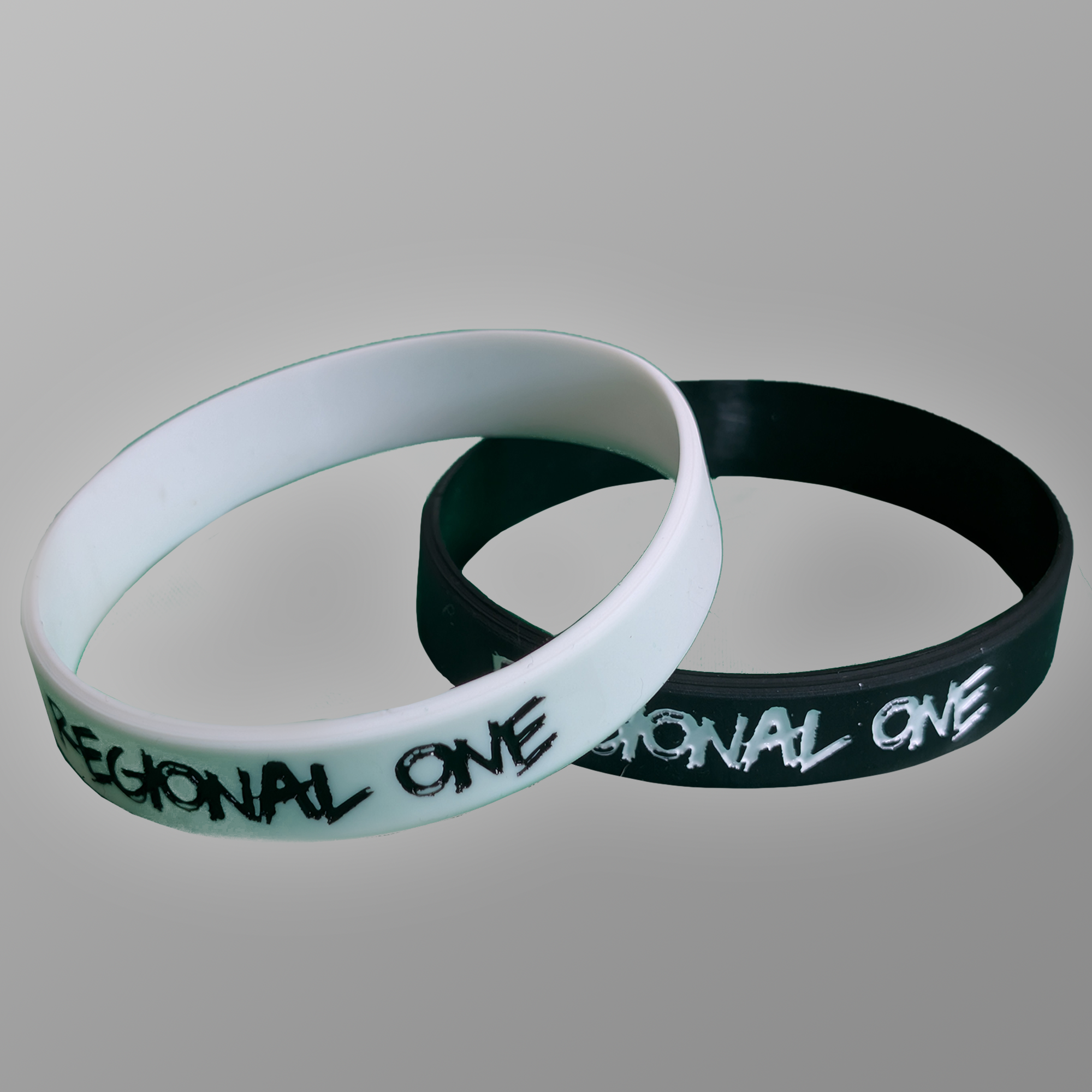 Black and White wristbands branded with Regional One logo.